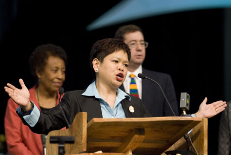 The Rev. Grace Cajiuat leads a liturgical version of the United Methodist Social Creed during a celebration of the creed's 100th anniversary at the 2008 General Conference. In the background are Bishop Beverly Shamana and Jim Winkler.
