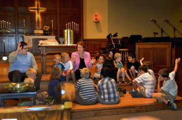 The Rev. Kathy Hartgraves instructs the children during the Aug. 4 worship at First United Methodist Church in Mitchell, S.D. Photo courtesy of the Dakotas Conference.