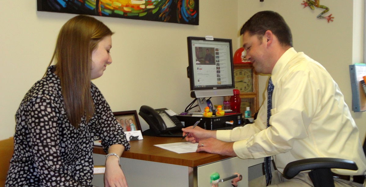 Ryan Brechbill, Director of the Center for Career & Professional Development at Otterbein University, advises student Haley Young, a public relations major. Photo by Marilyn Williams.