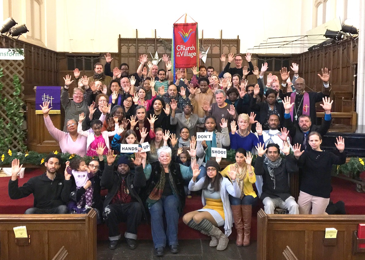 Members of Church of the Village, a multiethnic United Methodist congregation in Manhattan, join together after worship Nov. 30 in a show of solidarity with peaceful protesters in Ferguson, Mo. The church plans a prayer vigil at 5:30 p.m. ET Dec. 11.  Photo courtesy of Church of the Village