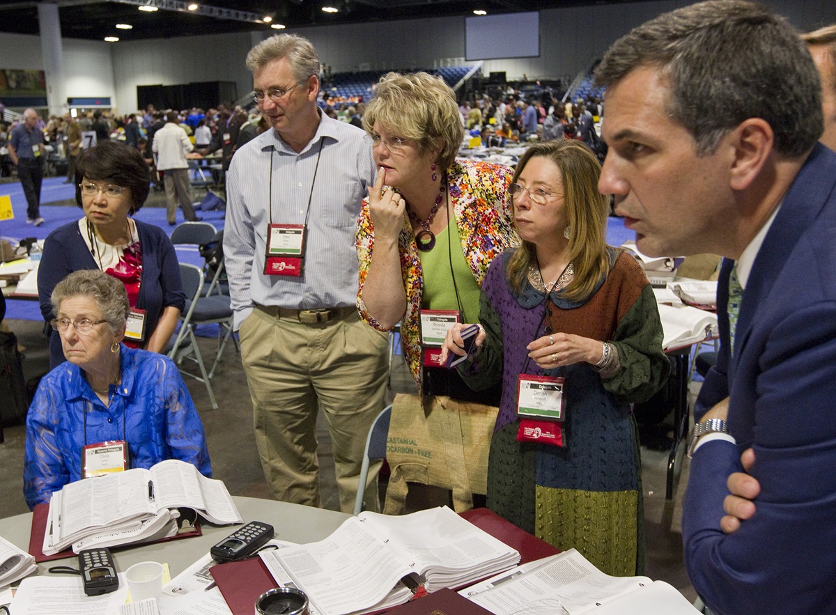 Members of the Virginia delegation huddle to discuss possible next steps after the United Methodist Judicial Council ruled the proposed "Plan UMC" for church restructuring to be unconstitutional during the 2012 United Methodist General Conference in Tampa, Fla.