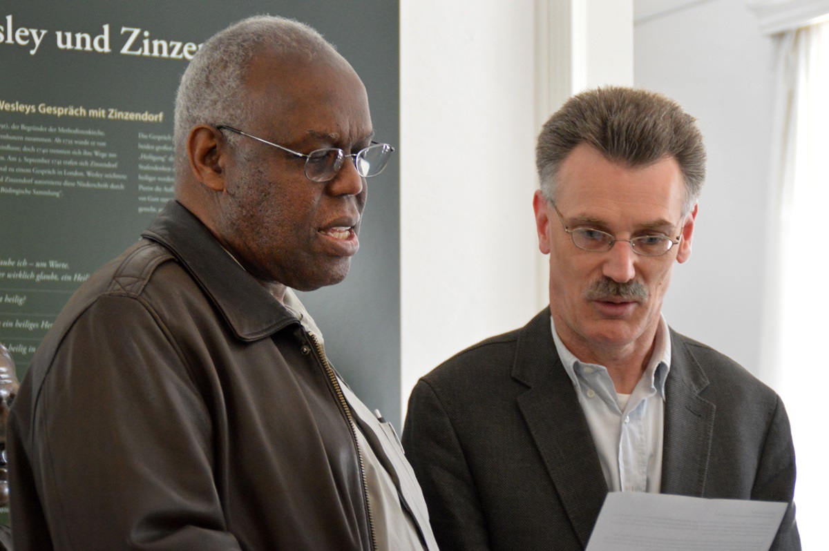 San Francisco Area Bishop Warner Brown Jr., left, joins with Peter Vogt, in reading a dialogue between John Wesley and Count Nikolaus Ludwig von Zinzendorf that Wesley later recounted. Methodism’s founder and the Moravians’ protector shared much in common but differed in their understanding of sanctification. Photo by Klaus Ulrich Ruof