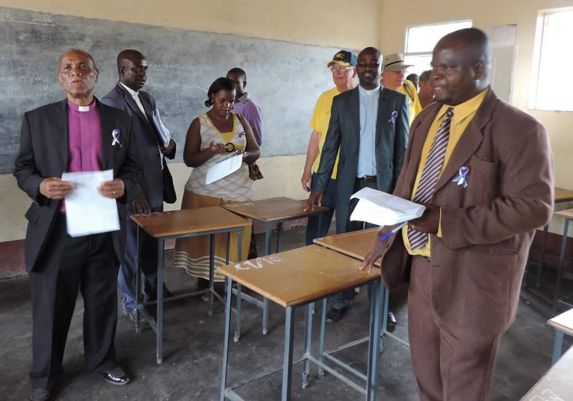 United Methodist Bishop Eben Nhiwatiwa (left) joins a tour of one of the new classrooms. Photo by Eveline Chikwanah