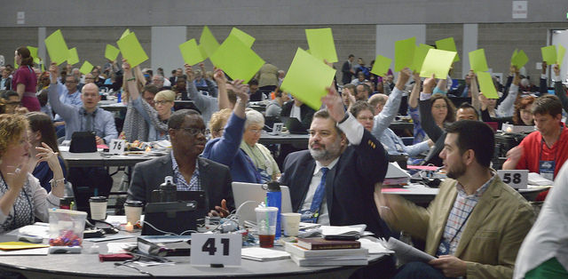 Faced with glitches in the electronic voting system, delegates use colored cards to vote on May 16 at the 2016 United Methodist General Conference in Portland, Ore. 