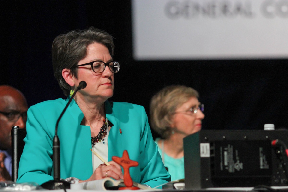 Bishop Sally Dyck, Chicago Episcopal Area, presides over the May 20 plenary session of the 2016 United Methodist General Conference in Portland, Ore. Behind her are Bishops Gregory Palmer and Janice Riggle Huie. Photo by Maile Bradfield, UMNS.