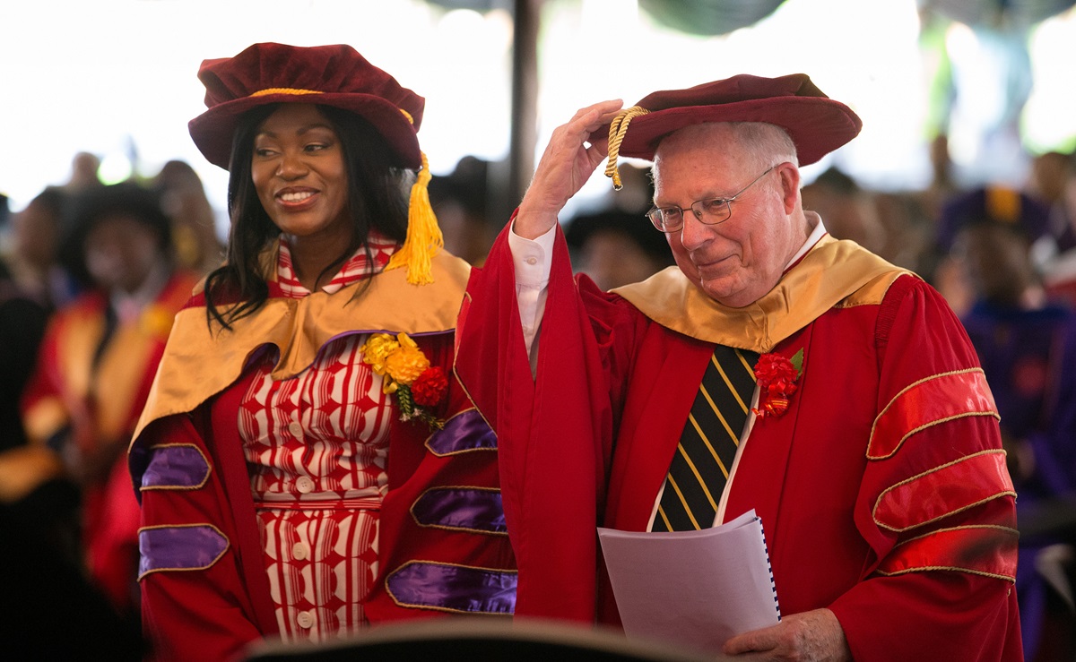 The Rev. James Waits (right) and Tsitsi Masiyiwa receive honorary doctorate degrees during the 25th anniversary celebration for Africa University in Mutare, Zimbabwe. Waits, who serves a professor emeritus of practical theology at Candler School of Theology, has a long history of civil rights activism in Mississippi. Masiyiwa and her husband are founders of run the Higherlife Foundation, a non-profit that provides access to education for African students. Photo by Mike DuBose, UMNS