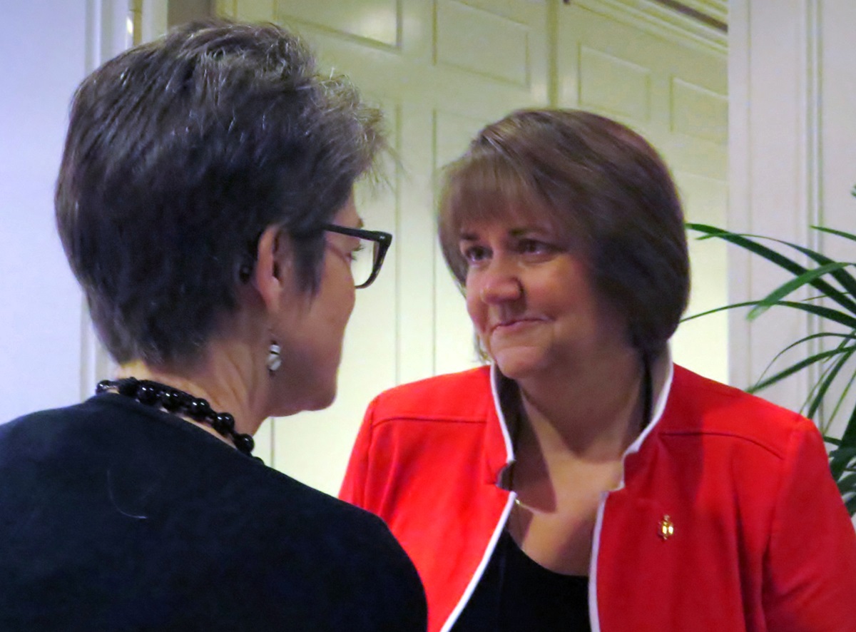 Mountain Sky Area Bishop Karen Oliveto speaks with Northern Illinois Bishop Sally Dyck during a Council of Bishops gathering in Dallas on April 30.
