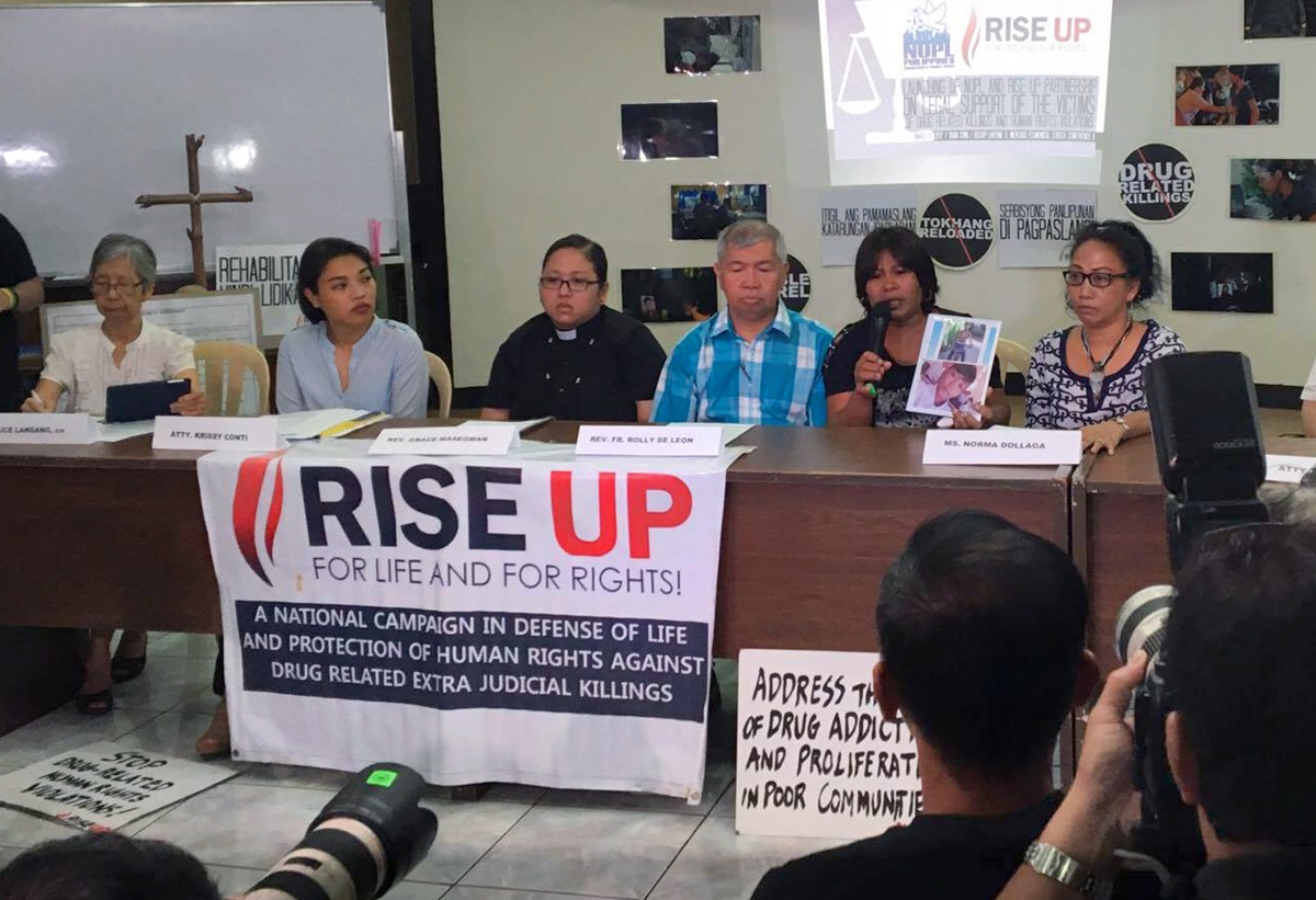 In a file photo, Norma Dollaga, right in black and white top, participates in a press conference held at the National Council of Churches in the Philippines, March 2016. Rise Up for Life and for Rights, a group dedicated to the protection of human rights against drug-related extrajudicial killings and violations in the Philippines, joined forces with the National Union of People’s Lawyers-National Capital Region for the press conference. Photo courtesy of Rise Up for Rights and For Life.
