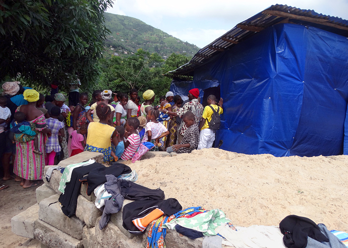 Patients, mainly nursing mothers and pregnant women affected by the Sierra Leone flood and landslide, queue up for health services at the United Methodist Disaster Response booth on Aug. 24 in Freetown. The church medical team will provide free medical services for the displaced for the next month. Photo by Phileas Jusu, UMNS.