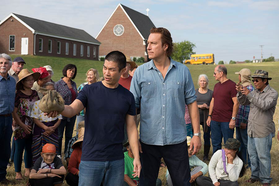 Ye Win (played by Nelson Lee) and the Rev. Michael Spurlock (played by John Corbett) talk about the work of All Saints’ Episcopal Church in the new movie “All Saints.” Photo courtesy of Sony.