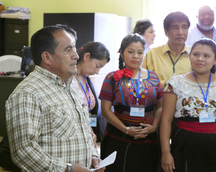 The Rev. Juan Ixtan Calgua, president of the Evangelical National Methodist Primitive Church of Guatemala, visits with other church leaders at the Organizacion para el Desarrollo Indigene Maya health clinic.