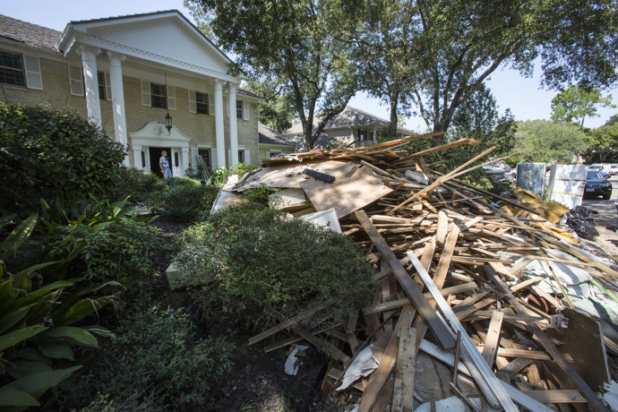 Debris piles up in front of a home affected by flooding from Hurricane Harvey in Houston.  Photo by Kathleen Barry, UMNS