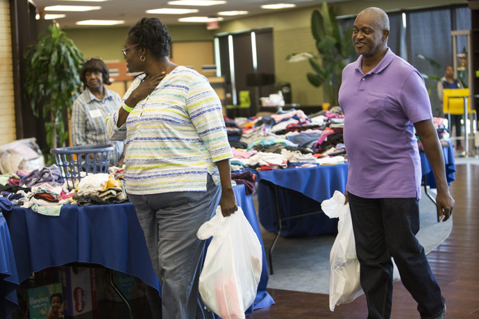 Winita and Larry Young, Hurricane Harvey flood victims, find donated clothing at Windsor United Methodist Church in Houston. Photo by Kathleen Barry, UMNS.