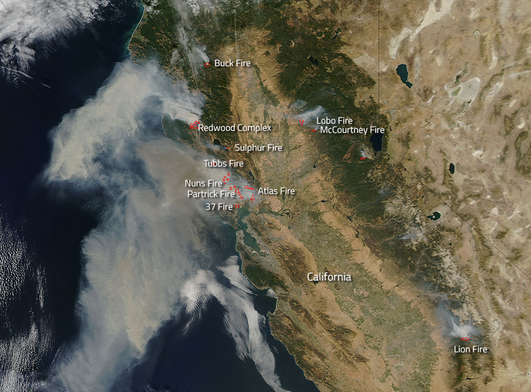 NASA's Aqua satellite natural-color image taken Oct. 9, shows actively burning areas of California (hot spots), detected by MODIS’s thermal bands, outlined in red. Wildfires in northern California have burned through nearly 170,000 acres, killing 23, destroying 3,500 homes and other structures, and forcing the evacuation of more than 20,000. Hundreds remain missing. NASA image courtesy of Jeff Schmaltz, LANCE/EOSDIS MODIS Rapid Response Team, GSFC. 