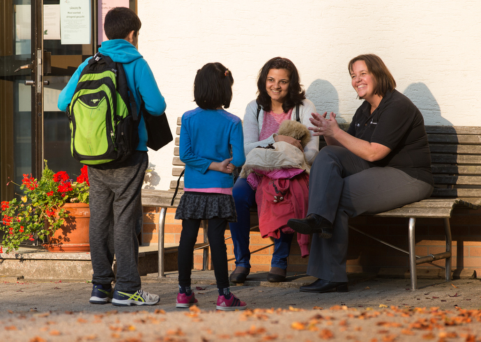 The Rev. Heike Miller (right) visits with Ruchi Shukla and her children Mohit (left) and Kayna outside the United Methodist Church of the Caller in Frankfurt, Germany. The family, recently arrived from India, was attending a German class offered by the church. Photo by Mike DuBose, UMNS.