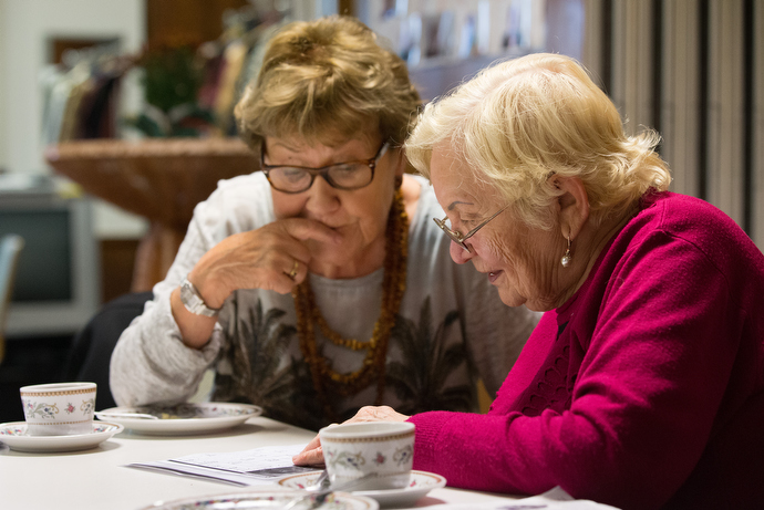 Retired teacher Doris Franke (left) tutors Russian immigrant Elmira Rieb during Café Tiramisu at the United Methodist Church of the Redeemer in Bremen, Germany. The weekly program gathers volunteers who teach German, help with translations of letters from the German government or simply talk with immigrants. Photo by Mike DuBose, UMNS.