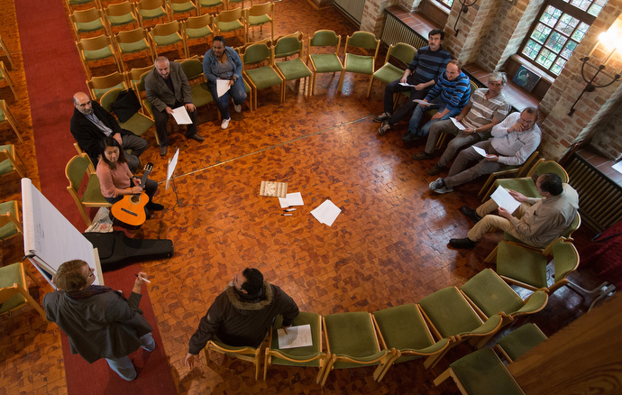 The Rev. Susanne Nießner-Brose (at white board) leads a German class for recent immigrants at the United Methodist Church of the Redeemer in Bremen, Germany. Photo by Mike DuBose.