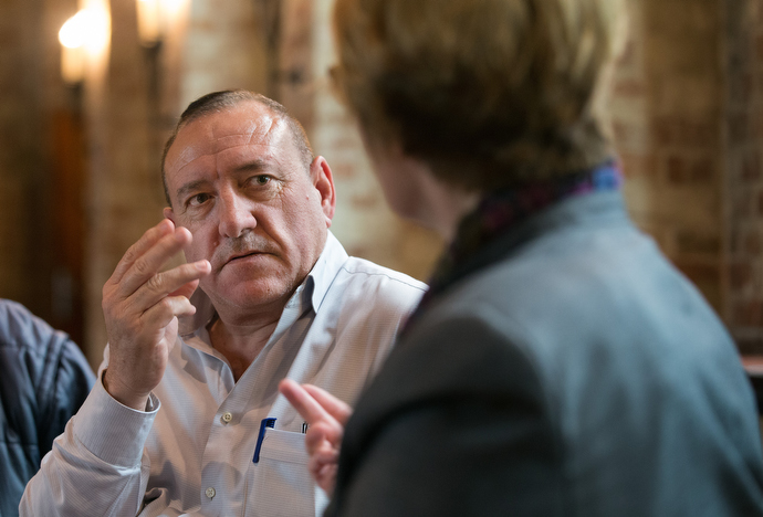 Hussein, an immigrant from Syria, talks with the Rev. Susanne Nießner-Brose during the beginning German class she teaches at  the United Methodist Church of the Redeemer in Bremen, Germany. Photo by Mike DuBose, UMNS.