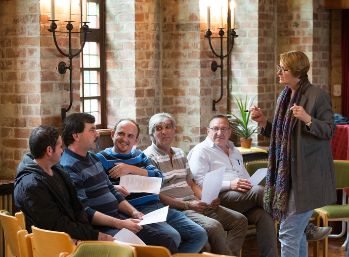 The Rev. Susanne Nießner-Brose (right) leads a German class for recent immigrants at the United Methodist Church of the Redeemer in Bremen, Germany. Photo by Mike DuBose, UMNS.