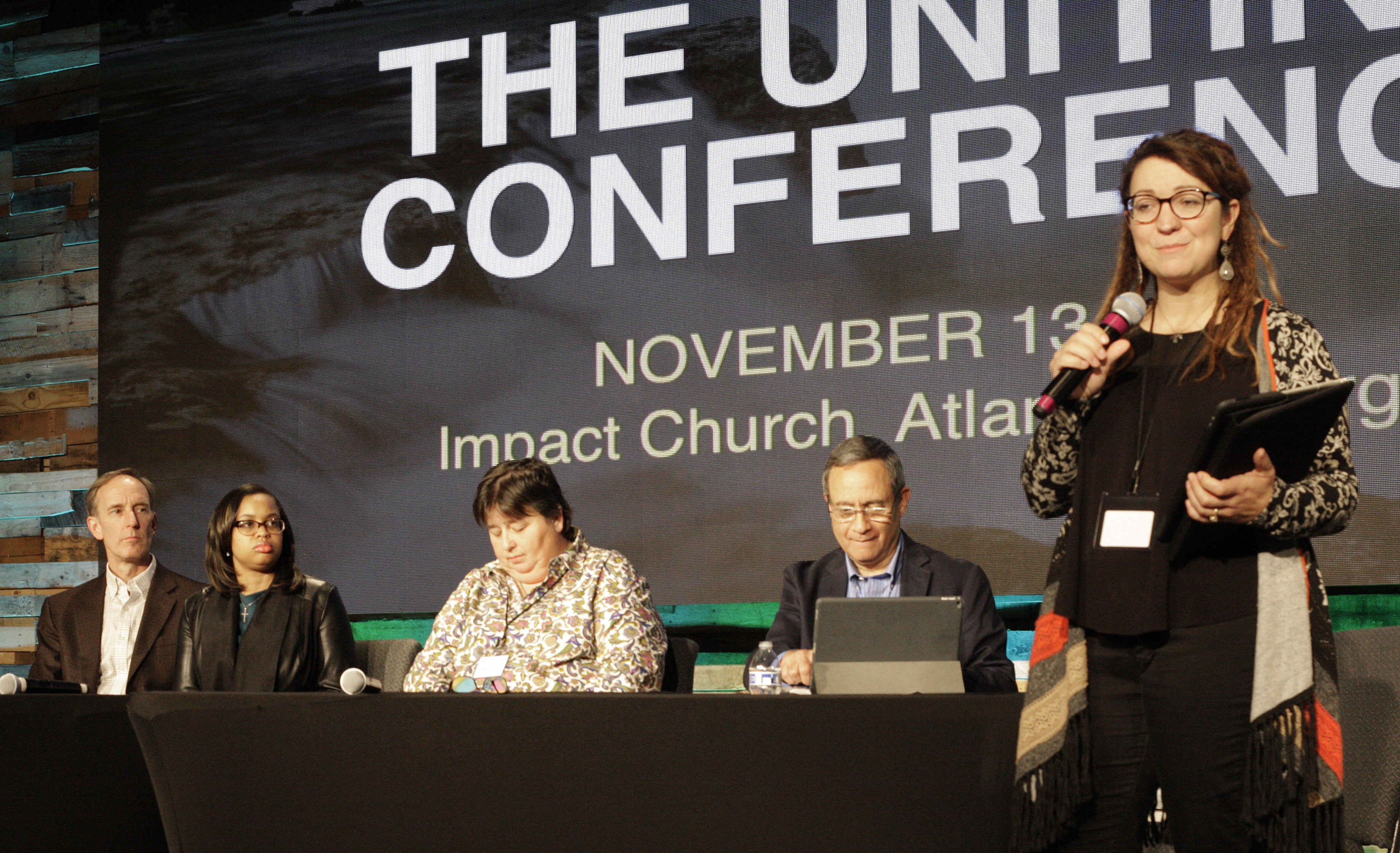 Panelists addressed attendees at the Uniting Methodist Conference. The panelists (from left) are: The Revs. Tom Berlin and Jasmine Smothers, Helen Ryde, Neil Alexander and the Rev. Rachel Baughman. Photo by Kathy L. Gilbert, UMNS.