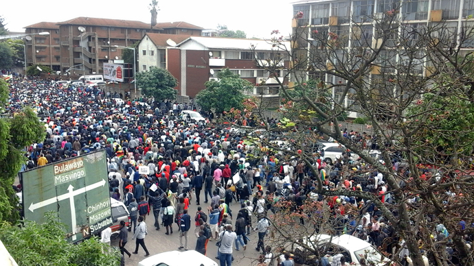 Tens of thousands of Zimbabweans gathered in Harare calling for President Mugabe to give up power after he was placed under house arrest.