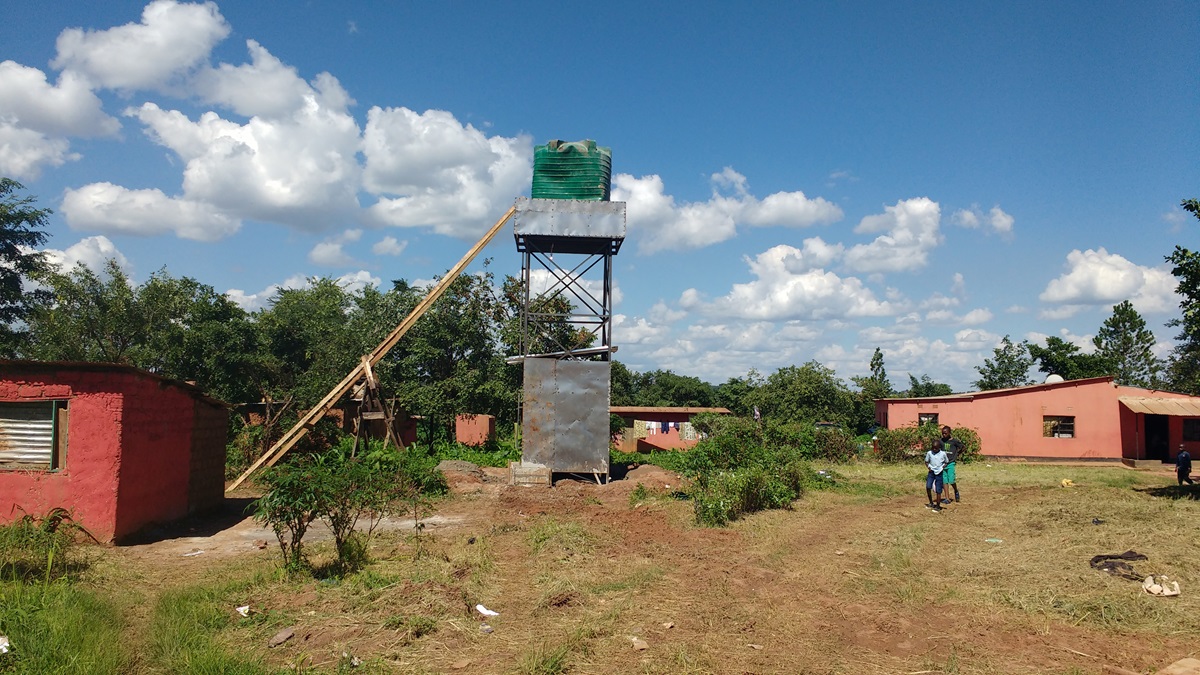 A new water tank helps combat cholera by providing clean water at the Jerusalem United Methodist Church in the community of Kandundu, Zambia. Photo by John Chikuta, UMNS.
