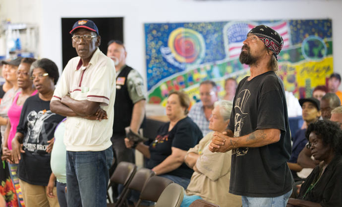 Earl Wollitt (right, foreground) casts his eyes upward during worship at Seashore Mission United Methodist Church in Biloxi, Miss., in 2015. File photo by Mike DuBose, UMNS.