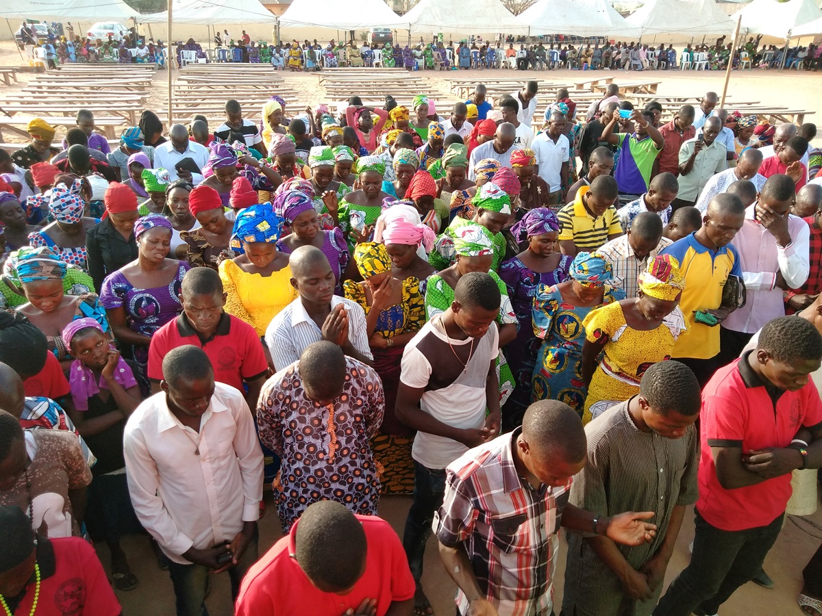 Members of the Southern Nigeria Conference pray during the 2018 Christian Revival Gathering held March 14-18 in Jalingo, Nigeria. More than 12,000 members attended, including a group who had left the conference five years ago. Photo by Ande I. Emmanuel, UMNS.