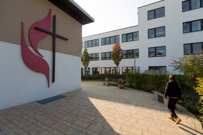 A parishioner arrives for worship at the United Methodist Church of the Redeemer in Munich. Photo by Mike DuBose, UMNS.