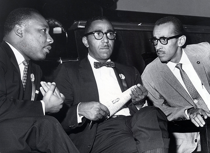 The Rev. Martin Luther King Jr. (from left), Joseph E. Lowery, Vice President of the Southern Christian Leadership Conference, and Wyatt Tee Walker, Executive Director, meet at First African Baptist Church in Richmond, Virginia, Sept. 25, 1963, for the SCLC convention. Photo by Carl Lynn, Richland Times-Dispatch.