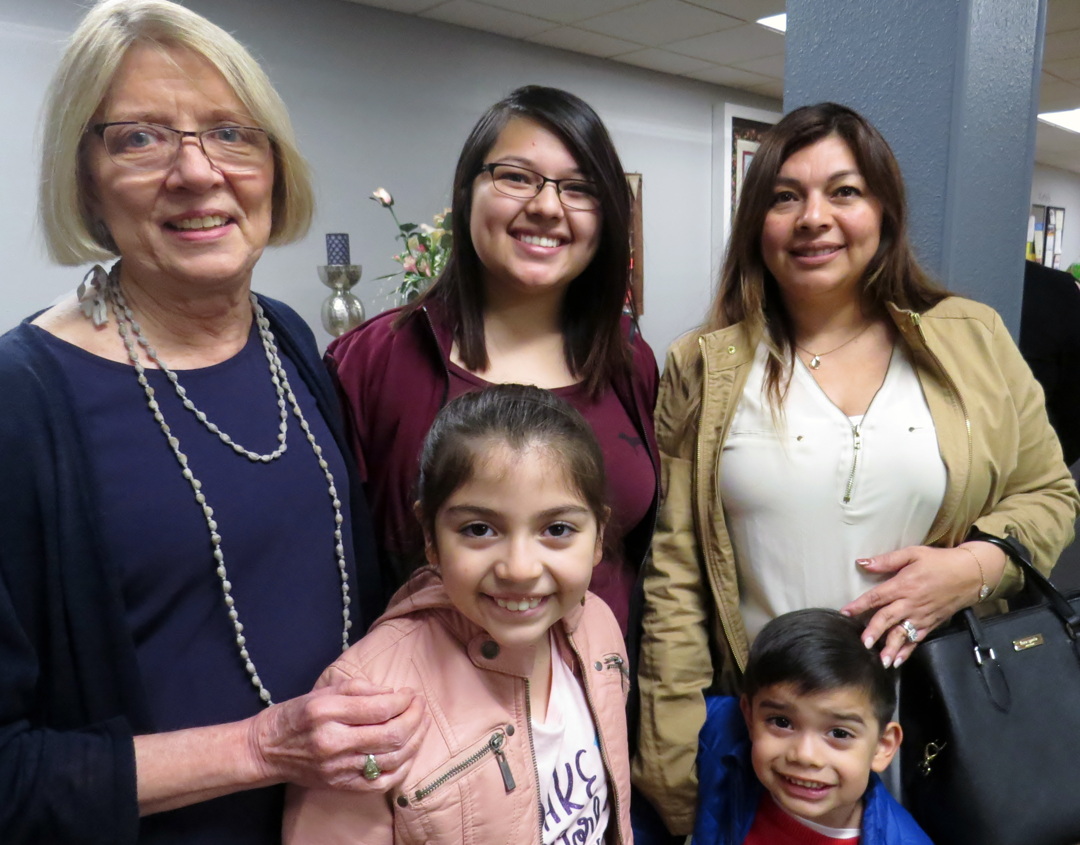 Kay Schecht has been a mentor to three generations of the Lopez family in Irving, Texas. She stands with Dalia Lopez (far right) and Dalia’s daughter, Selena, and in front are Selena’s children Mia, 8, and Ethan, 4. Schecht received the Foundation for Evangelism’s Distinguished Evangelist Award in recognition of more than 20 years of service to at-risk children and youth. Photo by Sam Hodges, UMNS.