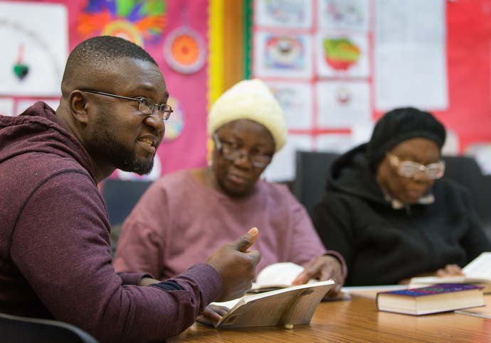 Eric Bediako (left) leads a Bible study with Judith Alpha (center) and Joyce Davies at Bermondsey Central Hall Methodist Church. Photo by Mike DuBose, UMNS.