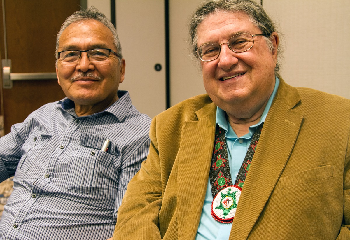 Norman Mark (left) and the Rev. Fred Shaw, director of the Native American Course of Study, talk about why it is important for Native pastors to blend traditional language and culture in ministry. Photo by Ginny Underwood, UMNS
