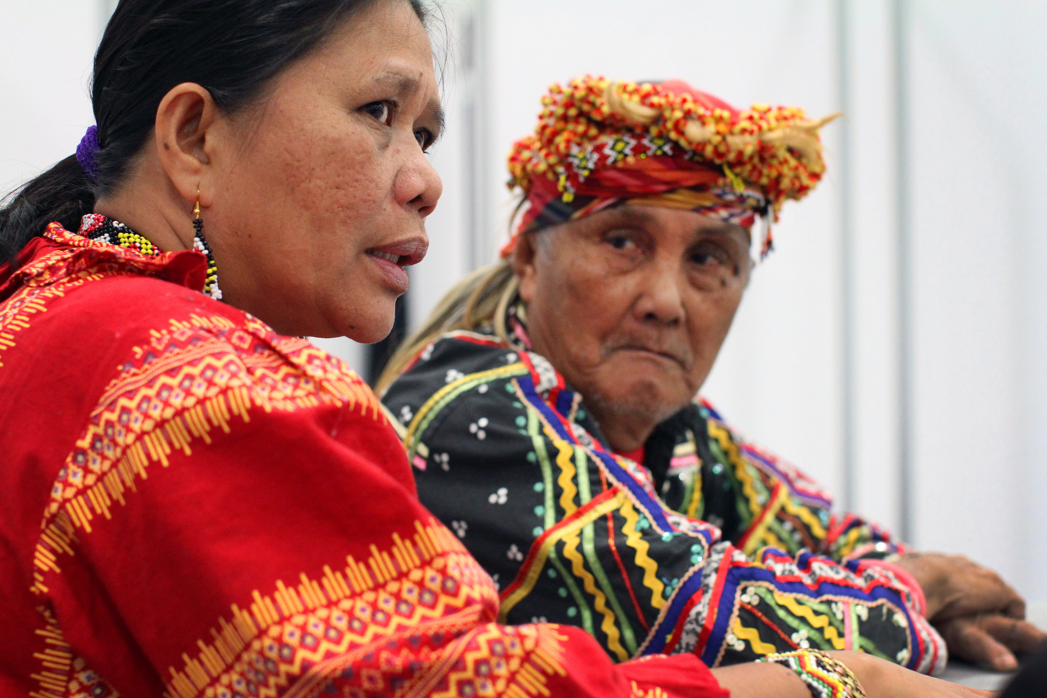 Norma Capuyan and Monico Cayon, indigenous leaders from the island of Mindanao in the southern Philippines, answer questions in the news area at the 2016 United Methodist General Conference at the Oregon Convention Center in Portland. Both shared experiences of discrimination and are part of the Lakbay Lumad USA tour.  Photo by Kathleen Barry, UMNS.