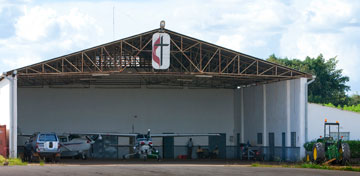 The United Methodist Cross and Flame marks the Wings of the Morning hangar at Lubumbashi International Airport. A UMNS photo by Mike DuBose.