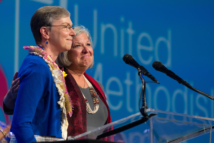 Dawn Wiggins Hare (right), of the United Methodist Commission on the Status and Role of Women, becomes emotional as she and Harriett Jane Olson lament the failure of two amendments to the church's constitution that promoted women’s equality. Photo by Mike DuBose, UMNS.