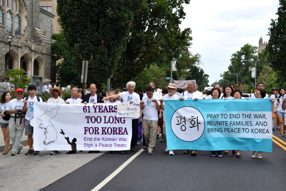 A peace committee shouting “"End armistice!” and “Peace treaty now!" marches from Foundry United Methodist Church to the White House in Washington during a rally on July 27, 2014. Korean-American United Methodists are hopeful as the United States and North Korea prepare for a possible summit in June.  File photo by Jacob Lee, UMNS. 