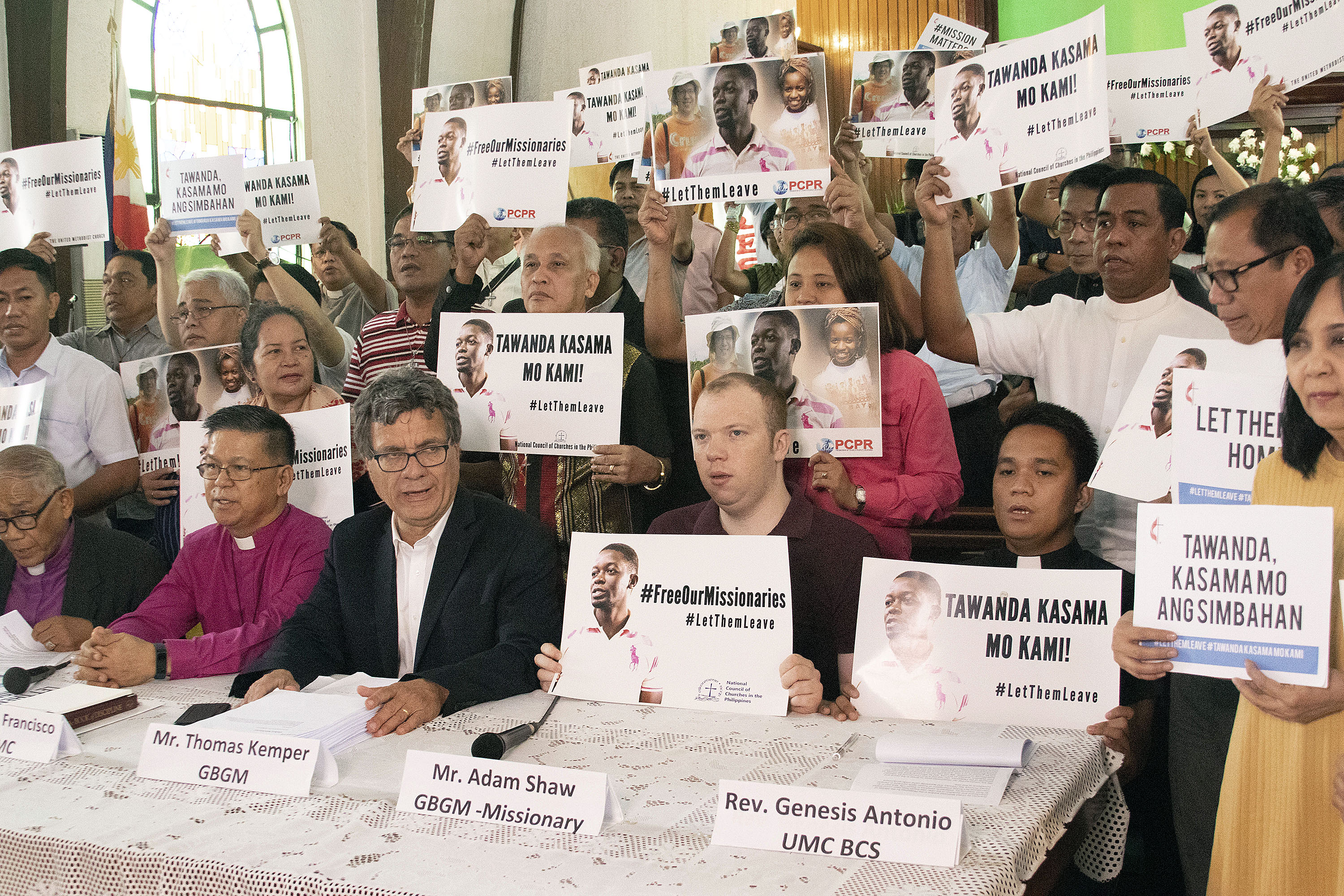 United Methodist leaders made a public appeal to the Philippines government to allow two detained missionaries leave the country. Seated (from left) are: Philippine Bishops Solito K. Toquero and Ciriaco Q. Francisco; Thomas Kemper, top executive of the United Methodist Board of Global Ministries; Adam Shaw, United Methodist missionary; and the Rev. Genesis Antonio of the Philippine Board of Church and Society. Photo by Jan Snider, UMCom.