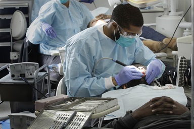 Student dentist Preston Harris sees a patient in the Meharry Medical College mobile dental clinic in Nashville, Tenn. Photo courtesy of Meharry Medical College. Student dentist Preston Harris sees a patient in the Meharry Medical College mobile dental clinic in Nashville, Tenn. Photo courtesy of Meharry Medical College.