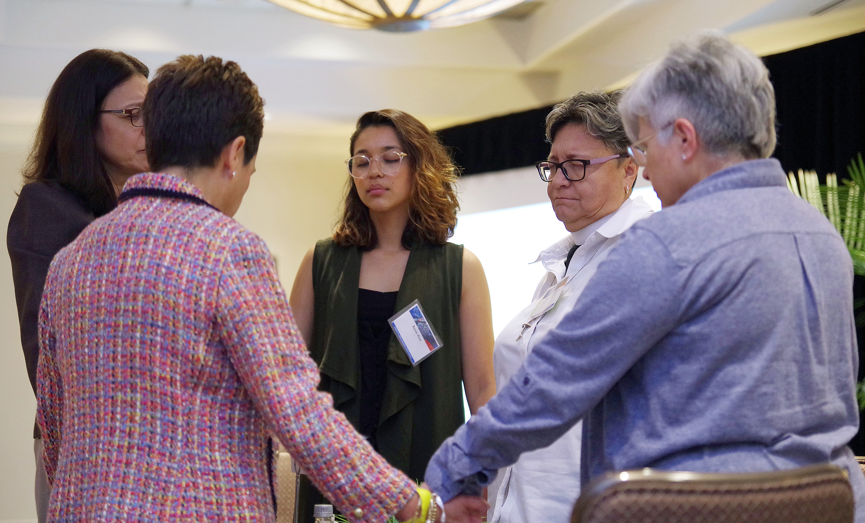 Members of MARCHA, meeting in Charlotte, N.C., pray together following a panel discussion on proposals to end The United Methodist Church’s division over homosexuality. From left are: the Rev. Ana Awilda Nolla, Bishop Cynthia Fierro Harvey, Rosie Rios and the Revs. Rosario Quiñones and Rosanna Panizo. Photo by Gustavo Vasquez, UMNS.