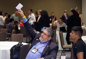 MARCHA members vote on a resolution to back the One Church Plan, which would leave decisions to allow same-gender weddings up to churches and gay ordination up to annual conferences in The United Methodist Church. Photo by Gustavo Vasquez, UMNS.