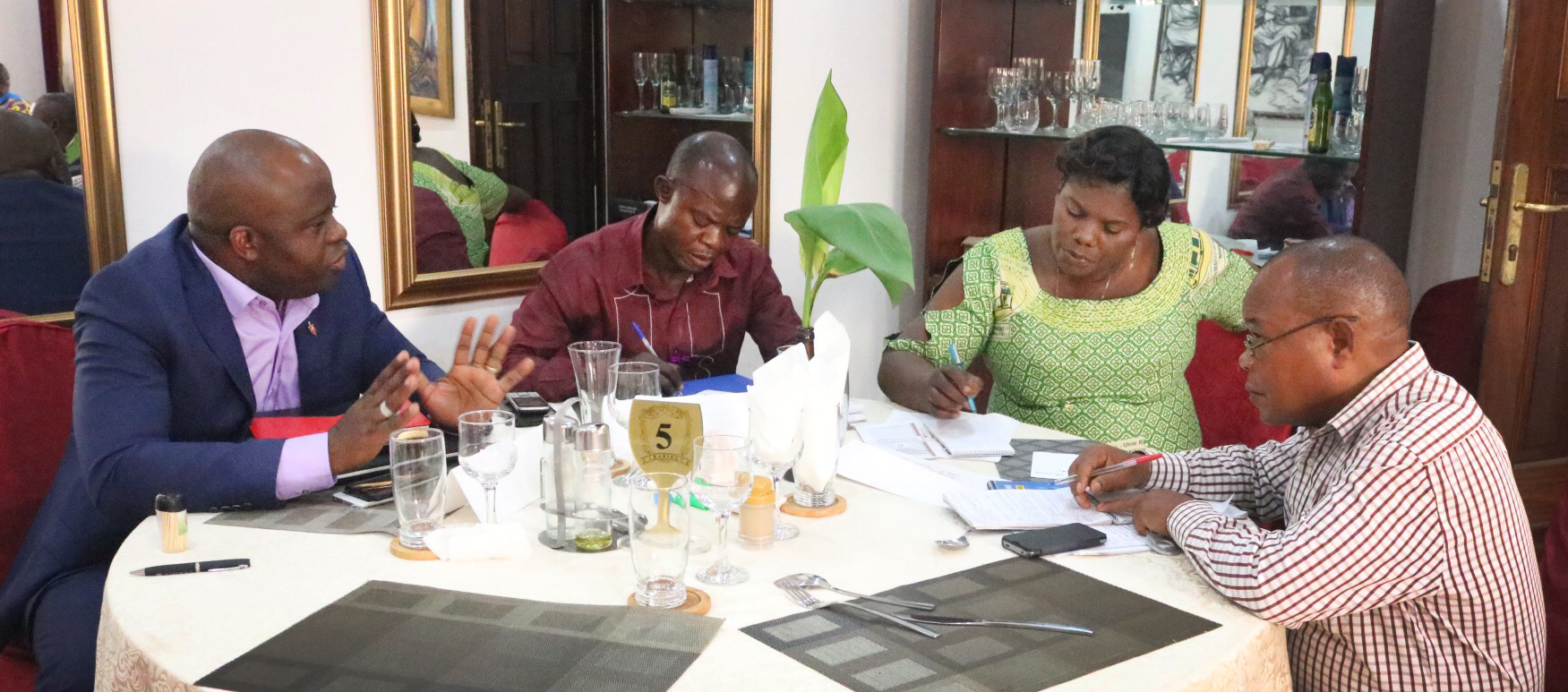 Bishop Mande Muyombo and delegates work in small groups during a tribalism workshop in Kindu, Congo. Photo by Judith Osongo Yanga, UMNS.