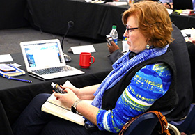 The Rev. Juliet Spencer, a commission member from the Louisiana Conference, tests out a new voting device that will be used by General Conference delegates in 2019 and 2020. Photo by Heather Hahn, UMNS.