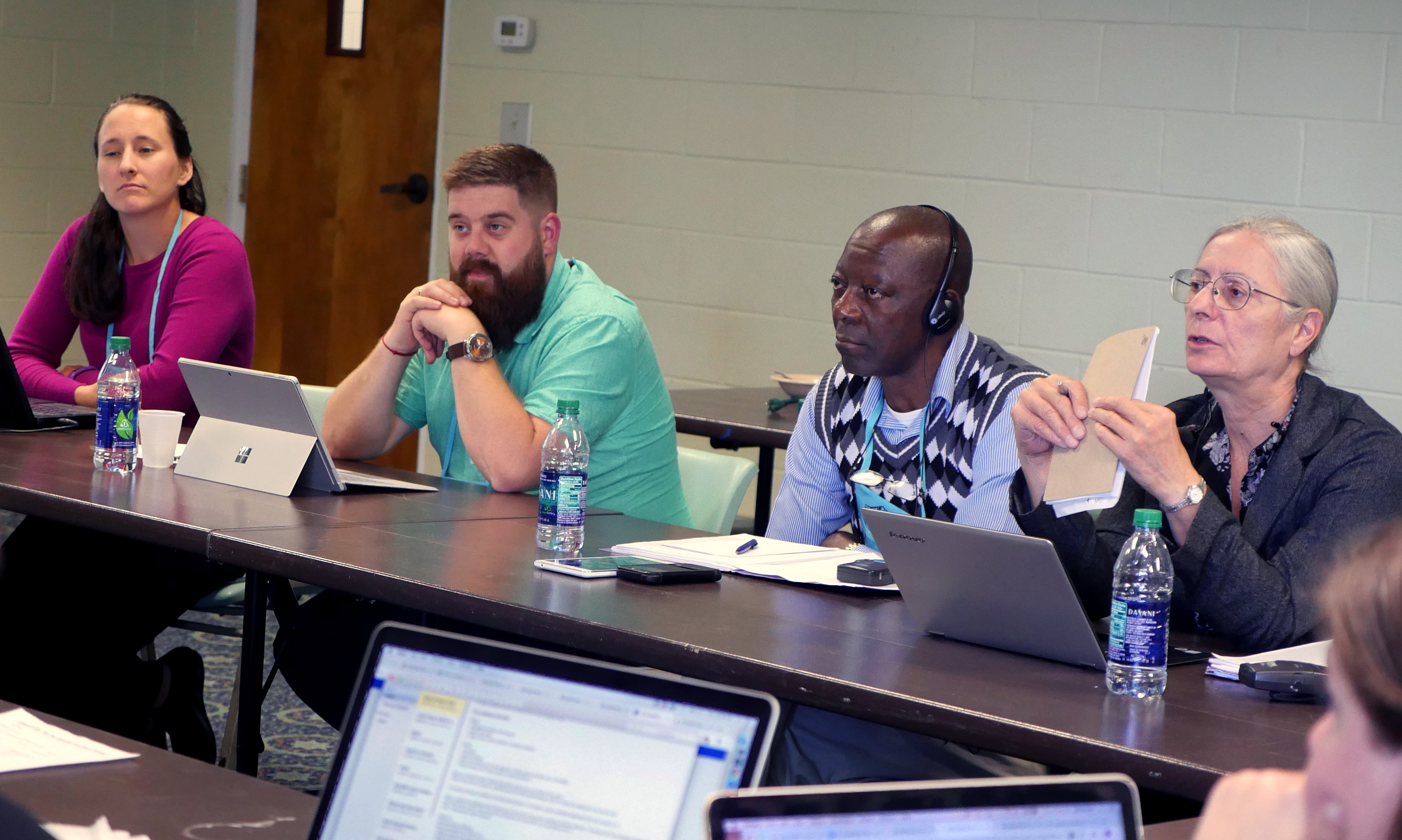 The Rules Committee of the Commission on General Conference discusses plans for one legislative committee at the 2019 special session. From left are Stephanie Henry, chair of the Rules Committee; commission members Audun Westad and Stanislas Kassongo, and translator Isabelle Berger. The commission met Oct. Oct. 3-5 at Epworth by the Sea in St. Simons, Ga. Photo by Heather Hahn, UMNS.