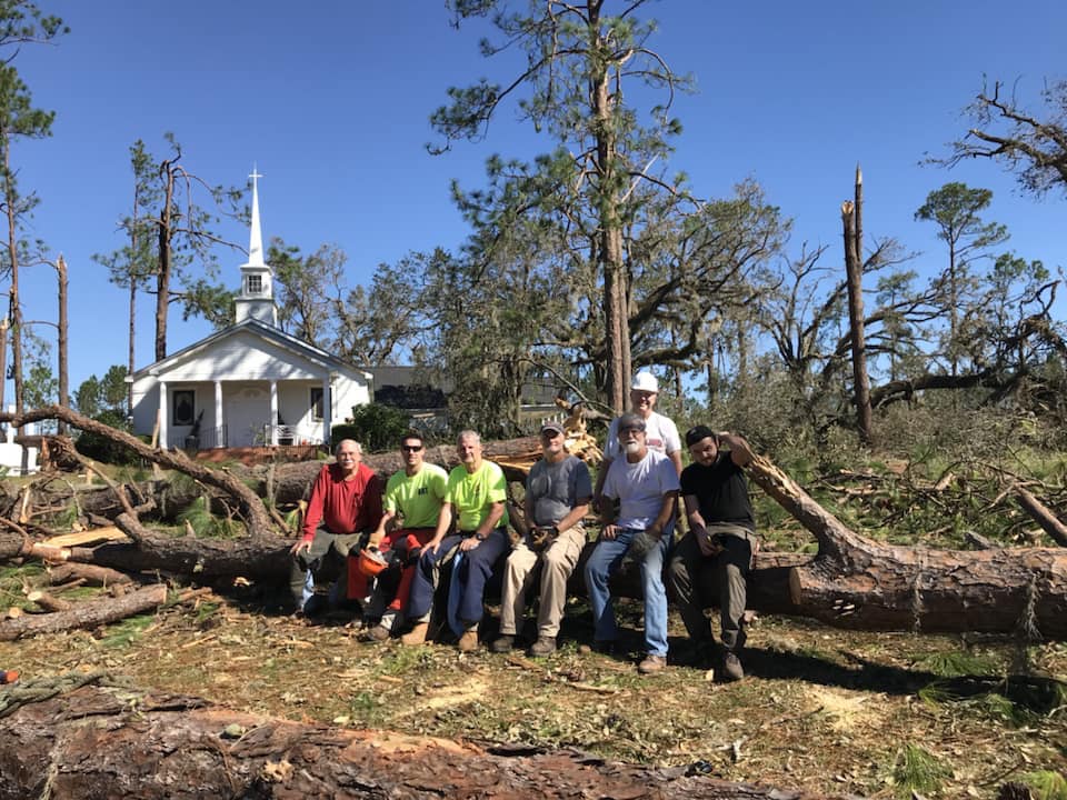 An early response team from Pierce Chapel United Methodist Church in Midland, Ga., pauses from their work in cleaning up storm debris left by Hurricane Michael at Cooks Union United Methodist Church in Colquitt, Ga. Photo courtesy of the South Georgia Conference.