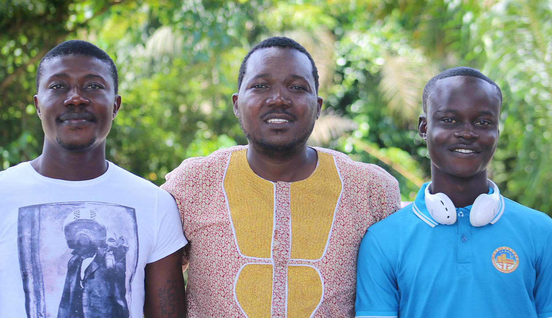 Jefferson Knight (center), director of the human rights agency of The United Methodist Church in Liberia, stands with residents of the New Life Recovery Center, Romeo “Jean Papi” Sonpon (left) and Life Buan. Photo by E Julu Swen, UMNS.