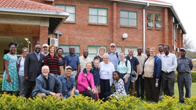 Members of a United Methodist delegation from Iowa and staff from Africa University pose in front of the Ubuntu Center, a retreat and meeting facility at the United Methodist-related institution in Mutare, Zimbabwe. Photo by Eveline Chikwanah. Members of a United Methodist delegation from Iowa and staff from Africa University pose in front of the Ubuntu Center, a retreat and meeting facility at the United Methodist-related institution in Mutare, Zimbabwe. Photo by Eveline Chikwanah.