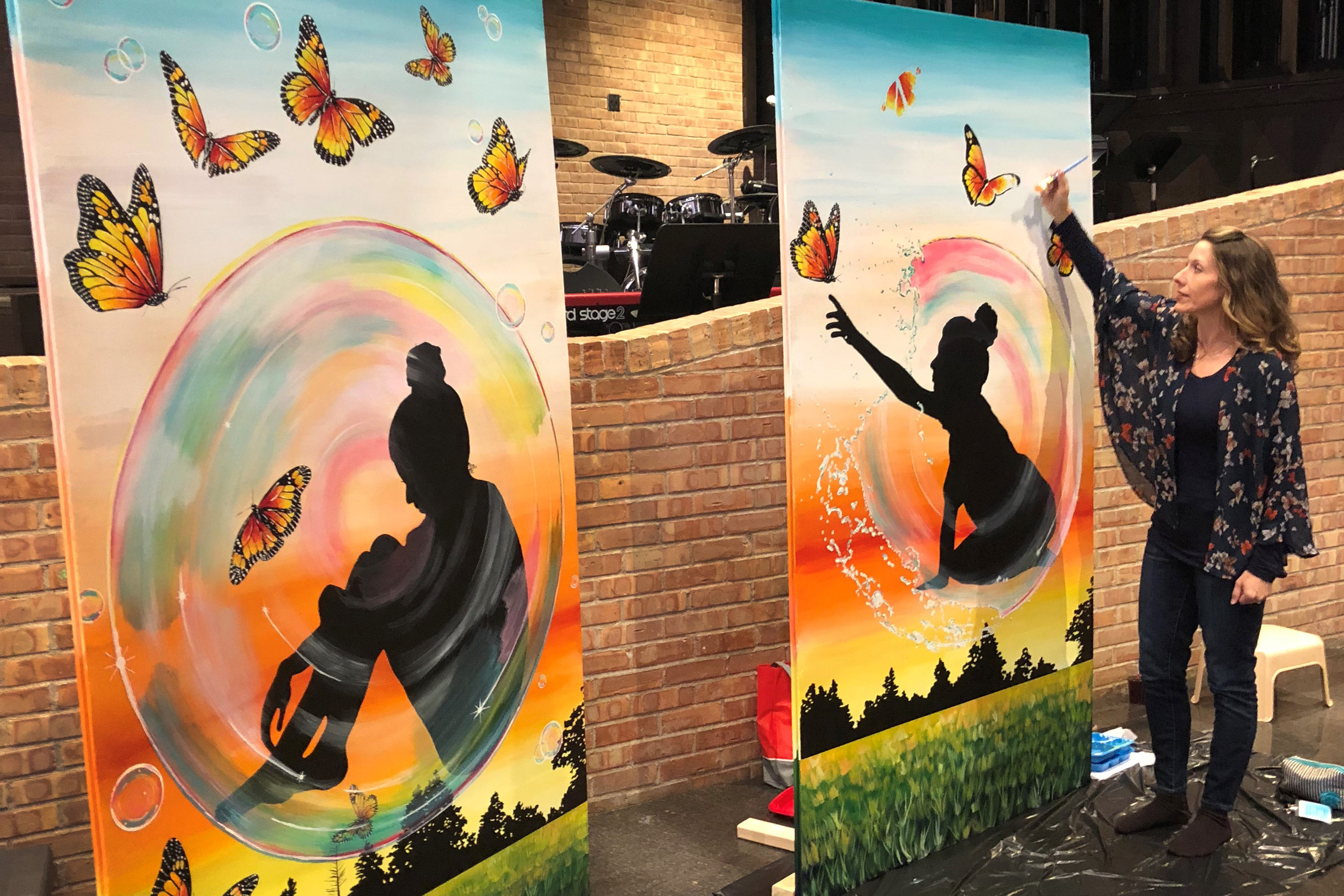 The Rev. Kristine Marshall of Bethel United Methodist Church in Anderson, Ind., spent her time at the Breaking Barriers Global AIDS Conference creating three canvases to represent the process of breaking free from the stigma of living with HIV/AIDS and living your fullest life. Photo by Crystal Caviness, United Methodist Communications. 