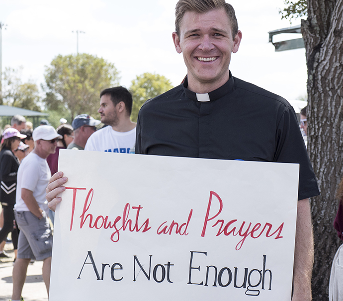 The Rev. Josh Beaty, pastor of discipleship at Christ United Methodist Church, Fort Lauderdale, Fla., was among many United Methodists who participated in the March for Our Lives rally held March 24 in Parkland, Fla. As mass shootings increase in the U.S., churches are considering how far they are willing to go to ensure security. Photo by Kathy L. Gilbert, UMNS.