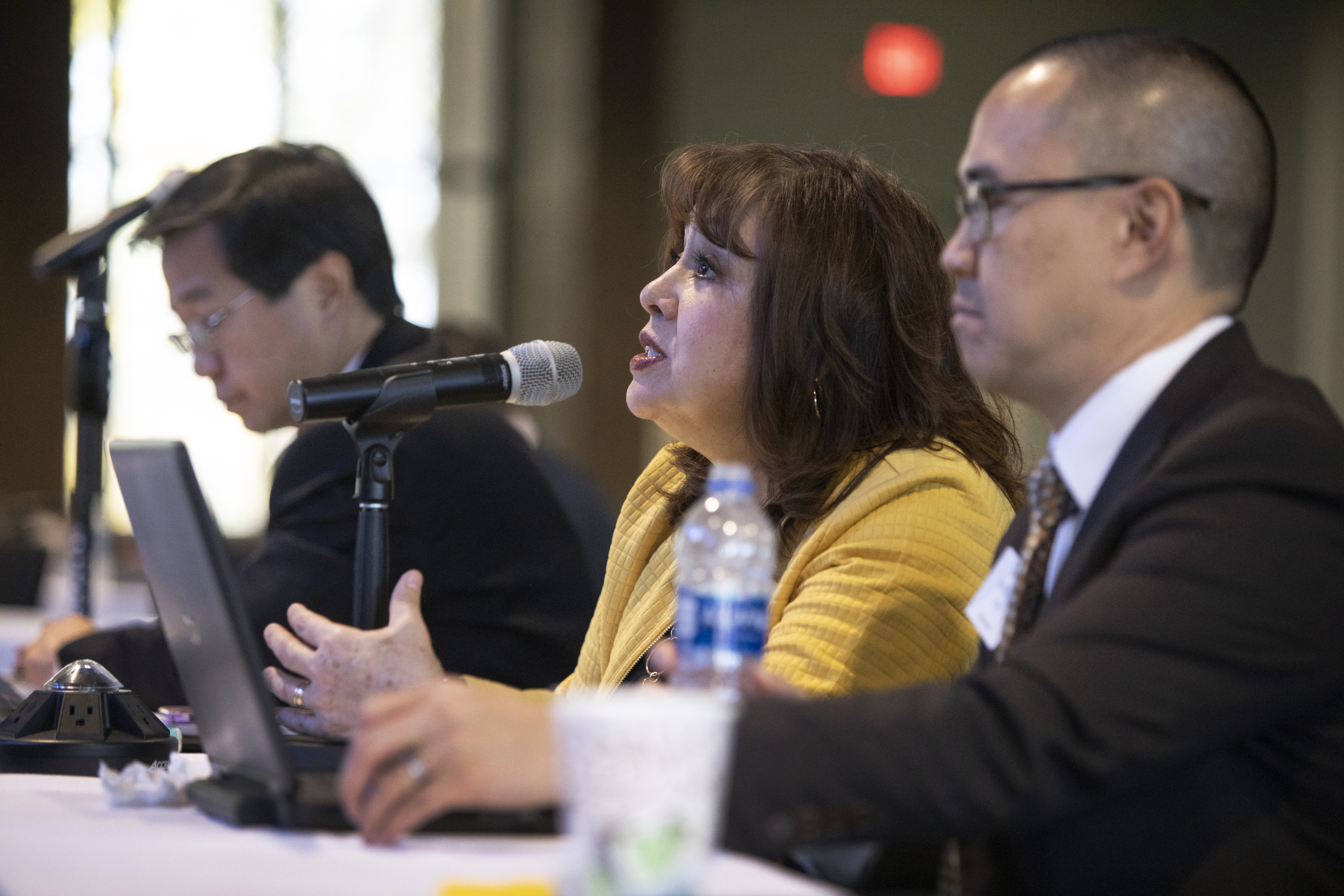 Bishop Minerva Carcaño asks a question during the board meeting of the General Council on Finance and Administration held at Providence United Methodist Church in Mount Juliet, Tenn. on Nov. 16, 2018. Pictured (from left) are Kenneth Ow, Carcaño, and the Rev. Anthony Tang. Photo by Kathleen Barry, UMNS.